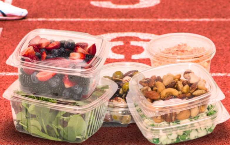 How does PET Plastic Food Tray maintain its shape and structural integrity when stacked for storage or shipping?